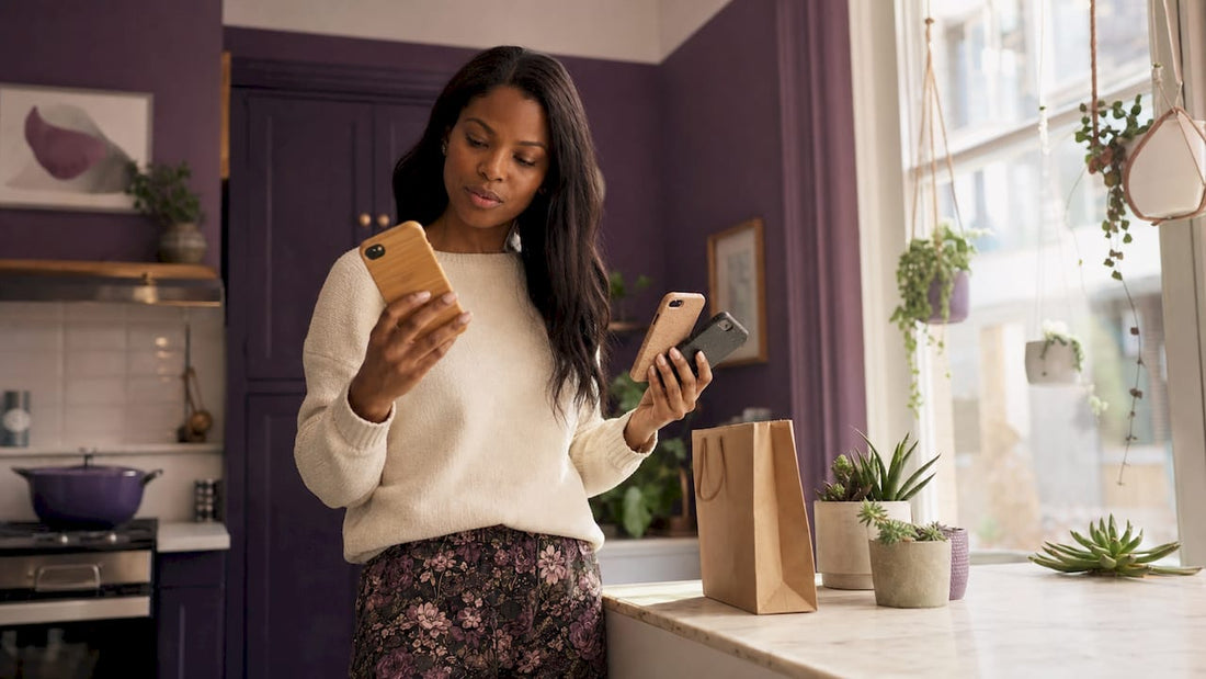 Person examining eco-friendly phone cases outdoors