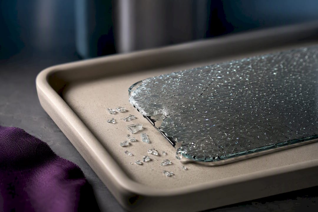 Fractured tempered glass protector fragments