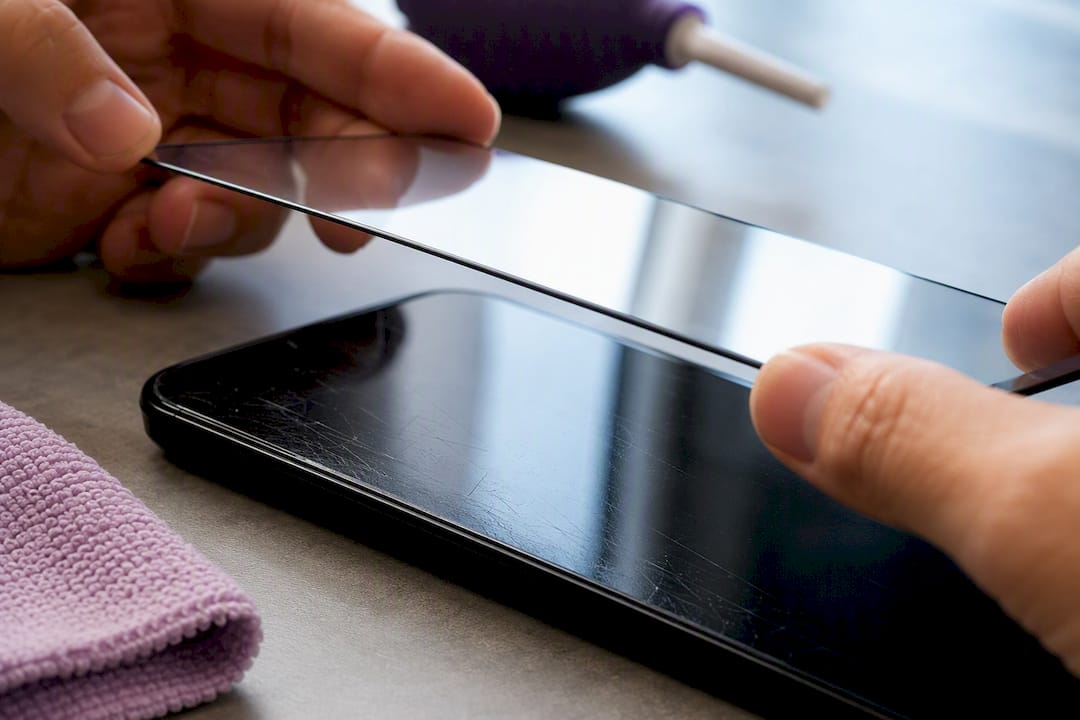 Applying protector over shallow screen scratches