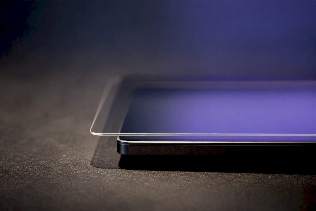 Layered screen protector edge on display panel